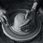 Hands at a potters wheel